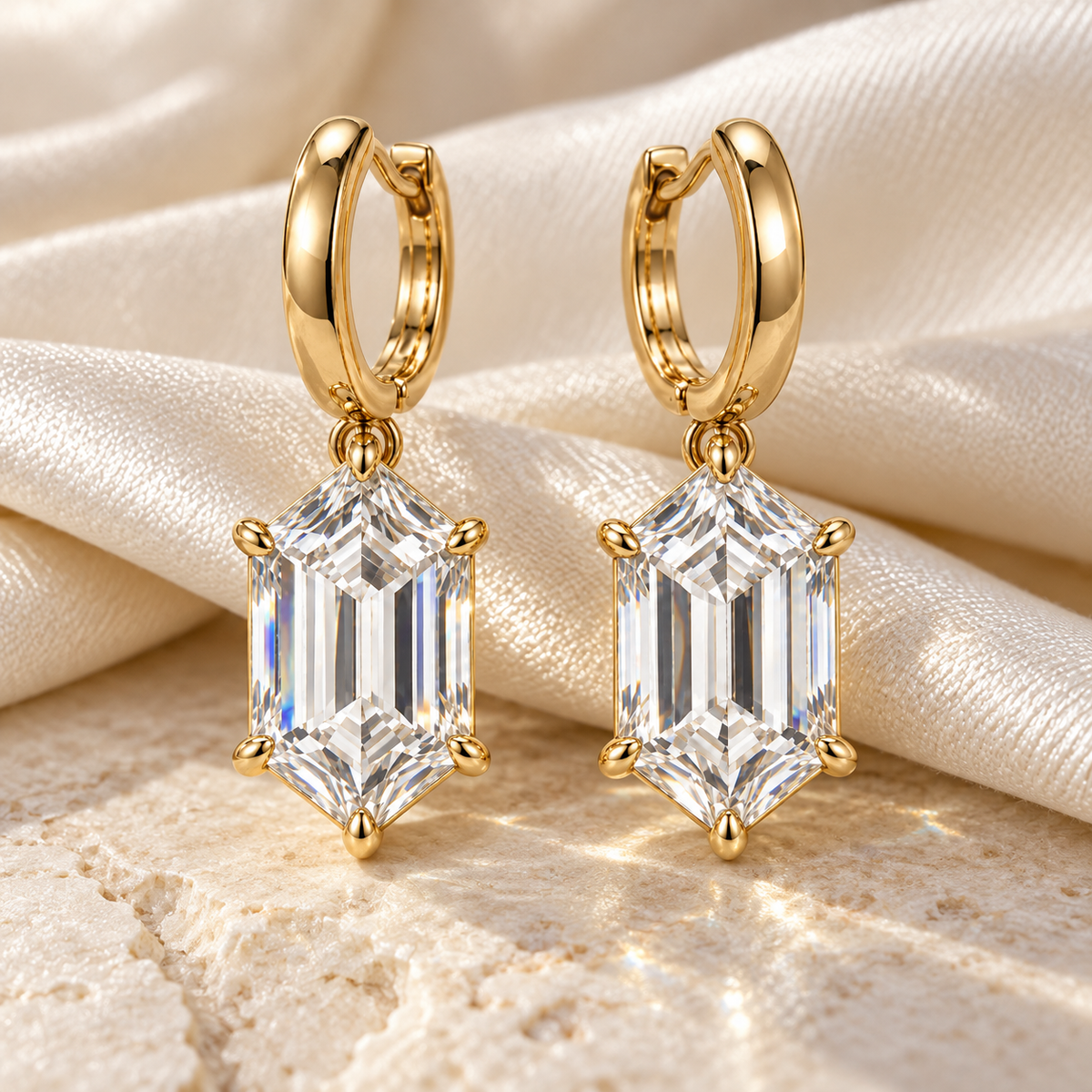 MISSISSI Hexagonal Huggie Drop Lab-Grown Diamond Earrings in yellow gold, editorial still life on ivory silk and pale stone; design visualization