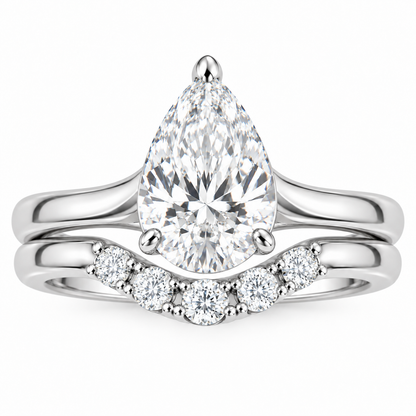 Vow pear engagement ring and contoured wedding band set in 14K white gold, top-down product view on white.