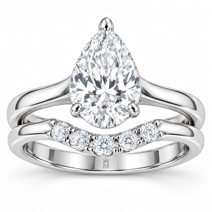 Vow pear engagement ring and contoured wedding band set in 14K white gold, close-up of the diamond setting.