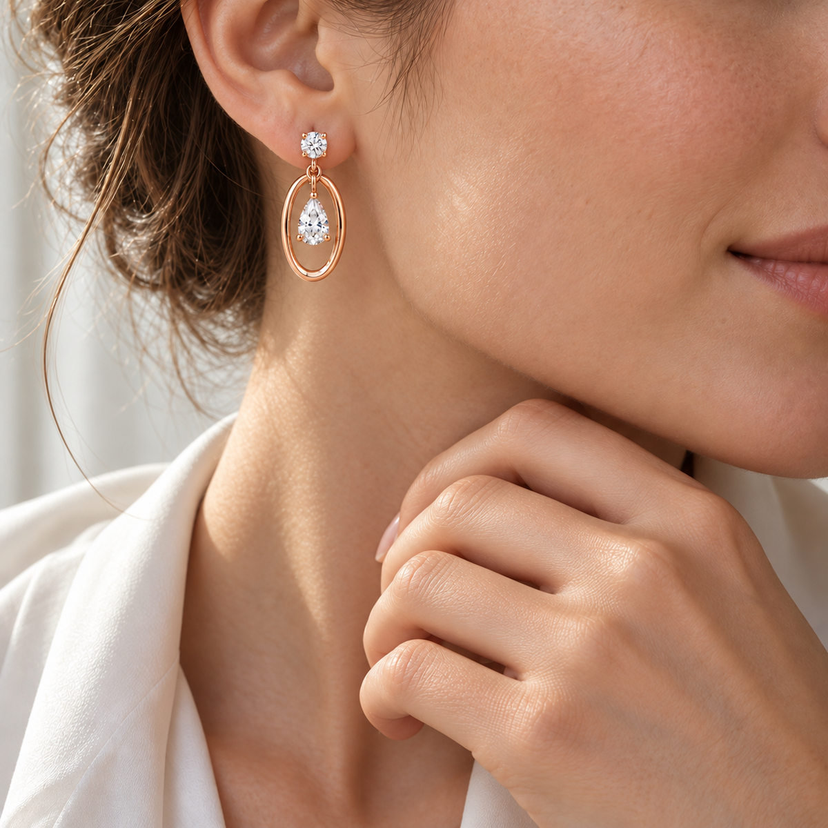 MISSISSI Pear Orbit lab-grown diamond earrings in 14K pale champagne rose gold, worn