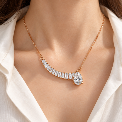 MISSISSI Off-Center Comet Pear and Baguette Lab-Grown Diamond Necklace design visualization in pale rose gold, worn at the neckline