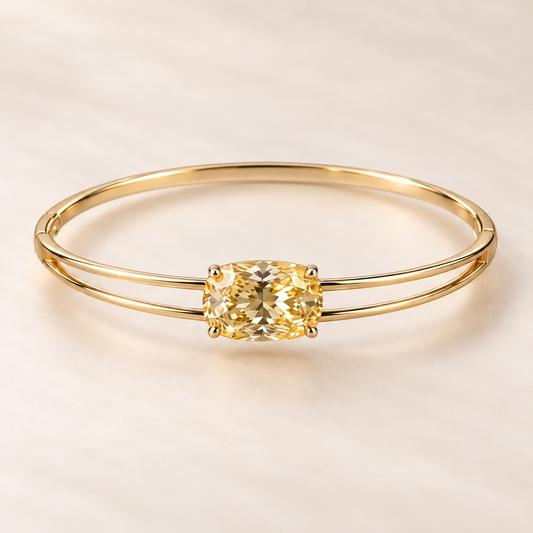 Design visualization of a horizontal cushion-cut lab-grown yellow diamond in a double-rail bangle front that joins into one rear band