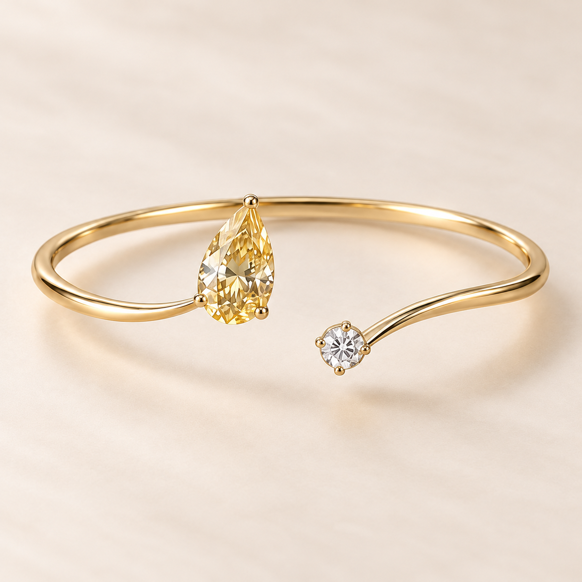 Design visualization of an open bypass bangle with an upward-pointing pear-shaped lab-grown yellow diamond opposite a small round lab-grown diamond