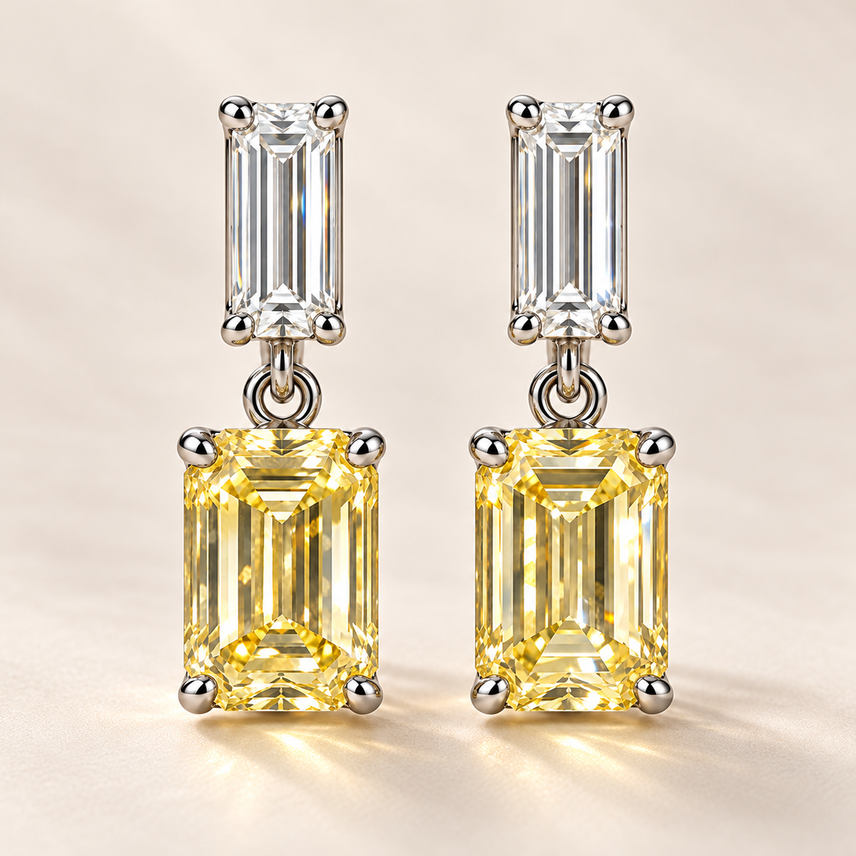 Design visualization of emerald-cut lab-grown yellow diamond drop earrings with baguette-cut lab-grown diamond upper accents and small connecting links