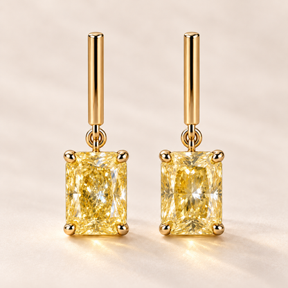 Design visualization of radiant-cut lab-grown yellow diamond drop earrings joined by small links to short, straight bars