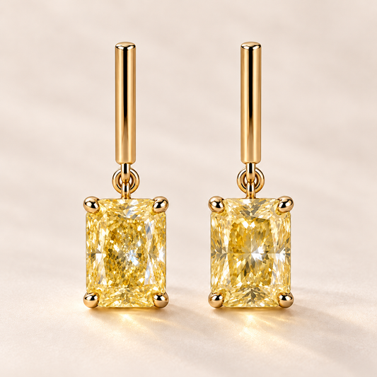 Design visualization of radiant-cut lab-grown yellow diamond drop earrings joined by small links to short, straight bars