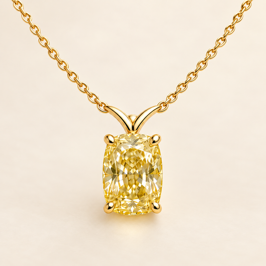 Design visualization of an elongated cushion-cut lab-grown yellow diamond pendant with a sculpted V-shaped connection to the chain