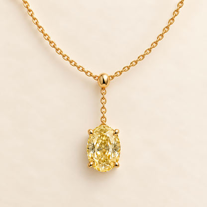 Design visualization of an oval lab-grown yellow diamond at the end of a short central chain drop on a lariat necklace