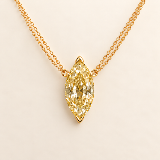 Design visualization of a vertical marquise-cut lab-grown yellow diamond pendant joined to paired chain strands on each side