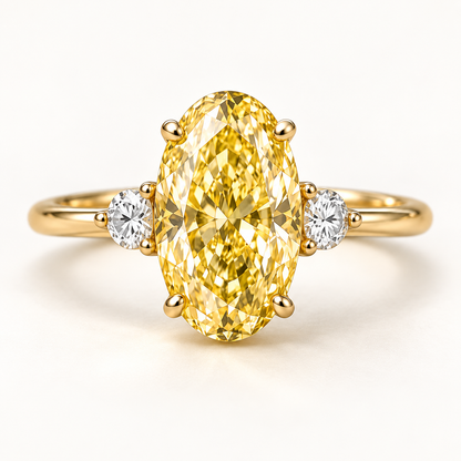 Design visualization of an oval lab-grown yellow diamond ring with one round lab-grown diamond on each side and a slender band