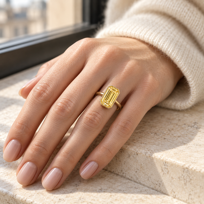 MISSISSI YR07 emerald-cut yellow diamond bezel ring, illustrative on-hand styling. Design visualization; not a scale guide.