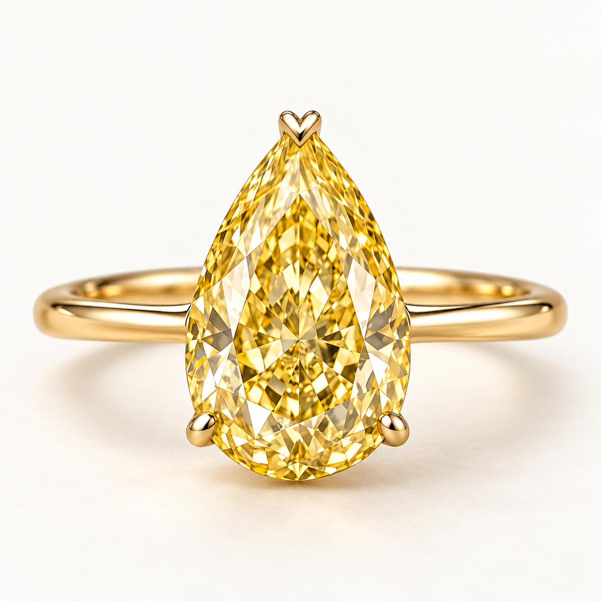 Design visualization of a pear-shaped lab-grown yellow diamond solitaire ring with an upward-pointing center and a slender band