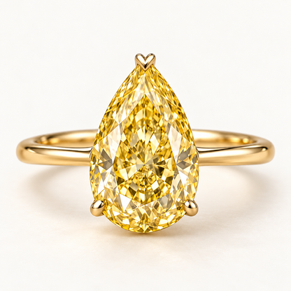 Design visualization of a pear-shaped lab-grown yellow diamond solitaire ring with an upward-pointing center and a slender band