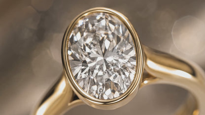 MISSISSI Oval brilliant Full bezel with open gallery ring advertisement. AI-generated design concept with champagne packaging.
