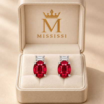 MISSISSI ME02 oval lab-grown ruby studs with horizontal baguette lab-grown diamonds in white gold, pair in a MISSISSI-branded packaging concept; design visualization