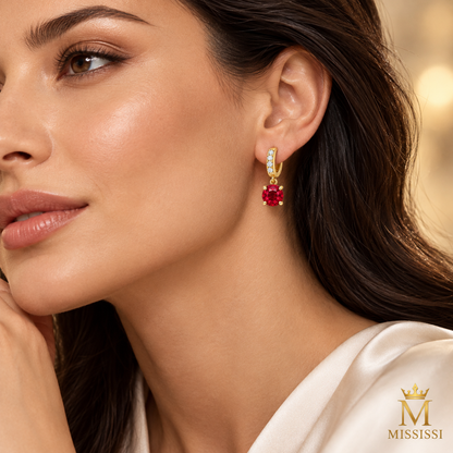 MISSISSI ME05 round lab-grown ruby drops on lab-grown diamond huggie hoops in yellow gold, worn by an adult model; design visualization