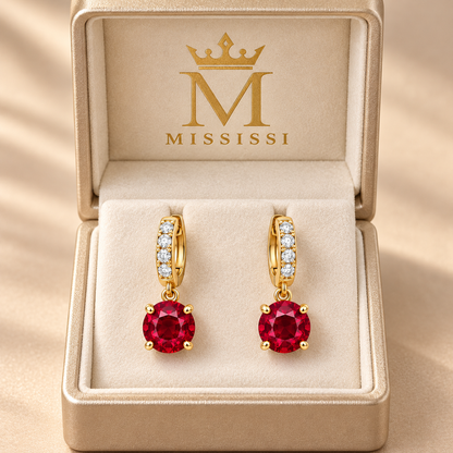 MISSISSI ME05 round lab-grown ruby drops on lab-grown diamond huggie hoops in yellow gold, pair in a MISSISSI-branded packaging concept; design visualization