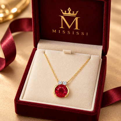 MISSISSI MN05 necklace displayed in burgundy packaging with the official crown and M emblem, packaging concept visualization