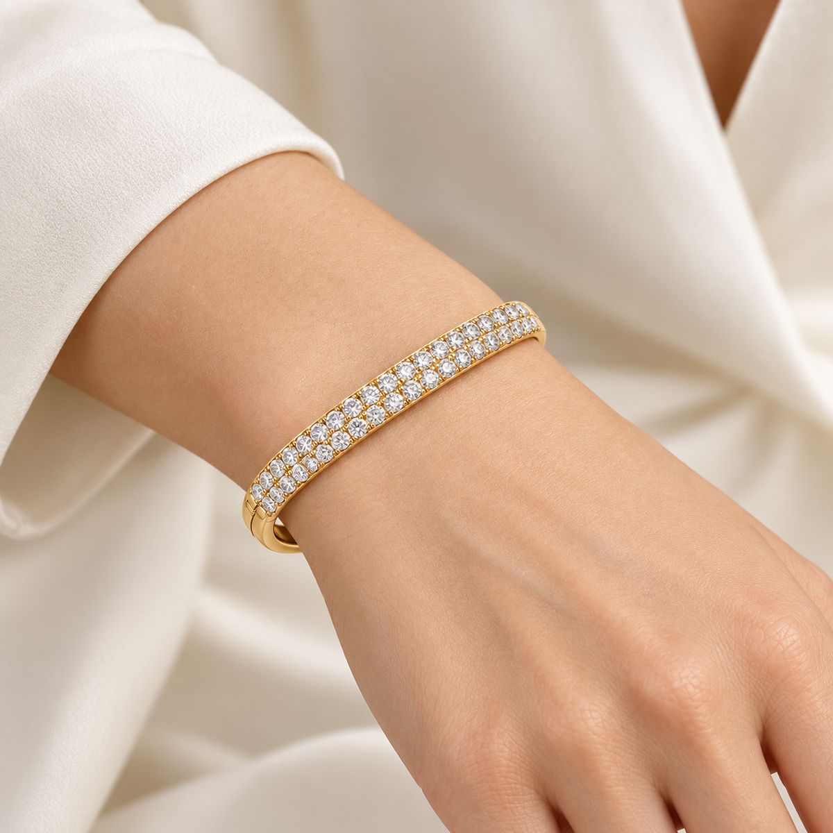 MISSISSI twin-row lab-grown diamond oval bangle in yellow gold, shown worn on a wrist