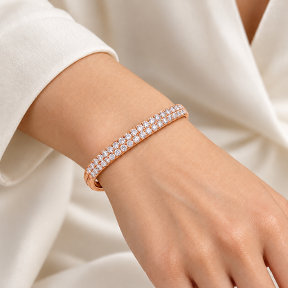 MISSISSI twin-row lab-grown diamond oval bangle in rose gold, shown worn on a wrist