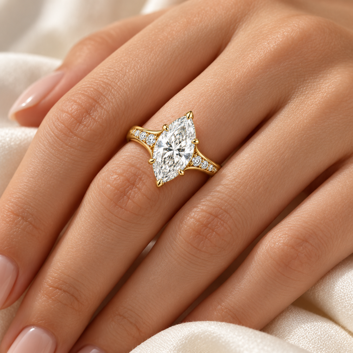 MISSISSI marquise lab-grown diamond cathedral ring in yellow gold, worn scale view with graduated diamond shoulders.