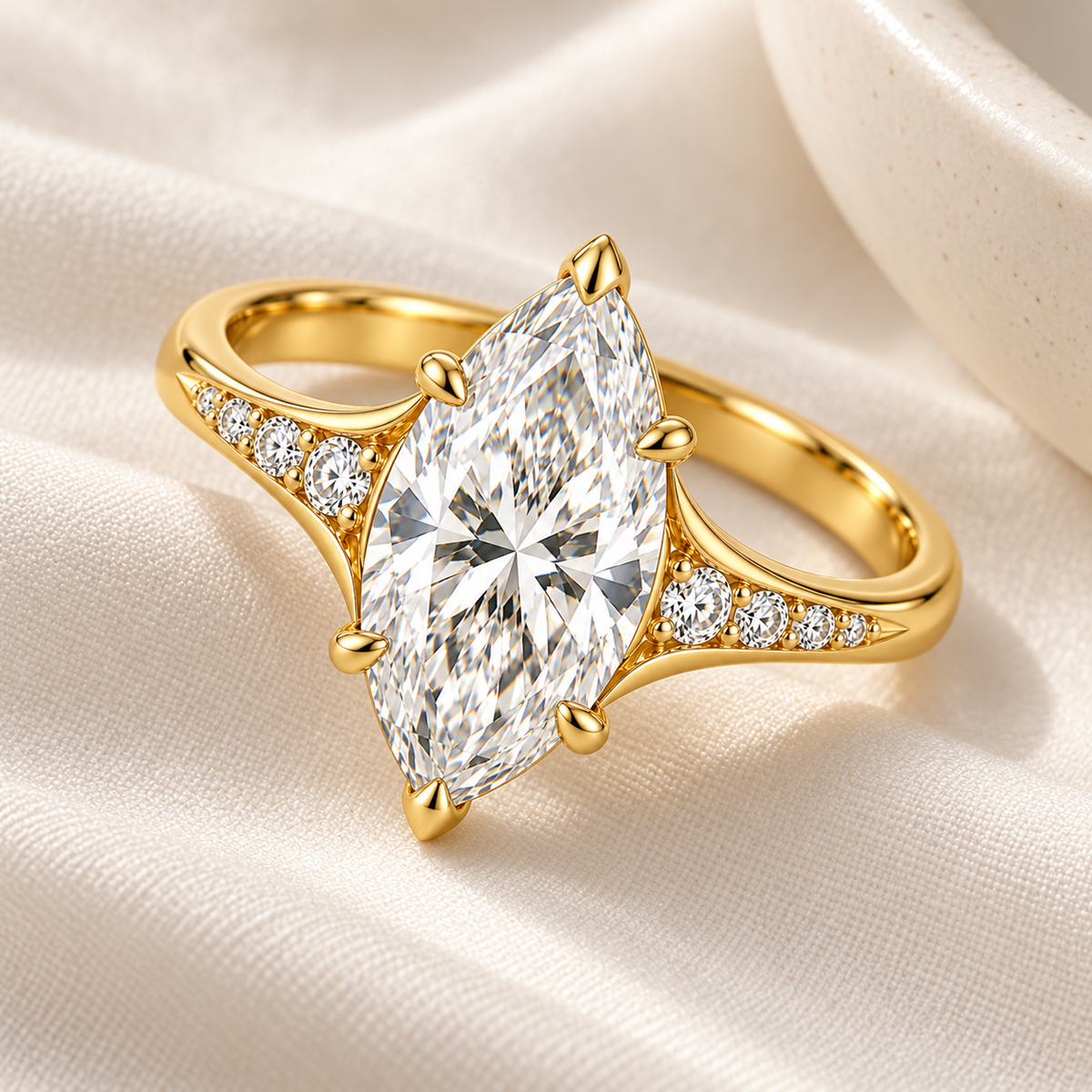 MISSISSI marquise lab-grown diamond cathedral ring in yellow gold, ivory styling view with graduated diamond shoulders.