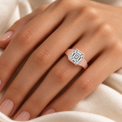 MISSISSI Asscher lab-grown diamond bezel ring in soft rose gold, worn scale view with satin shoulders and polished edges.