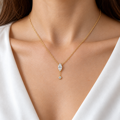 MISSISSI U08 Marquise Y Drop necklace in 14K yellow gold, natural-scale adult collarbone wear; design visualization with a vertical marquise diamond and a small round bezel-set diamond on a short chain drop.