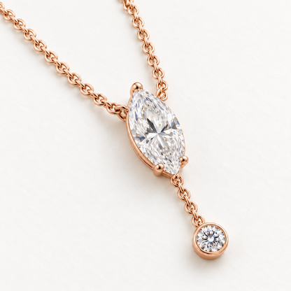 MISSISSI U08 Marquise Y Drop necklace in 14K rose gold, three-quarter structure on ivory; design visualization with a vertical marquise diamond and a small round bezel-set diamond on a short chain drop.