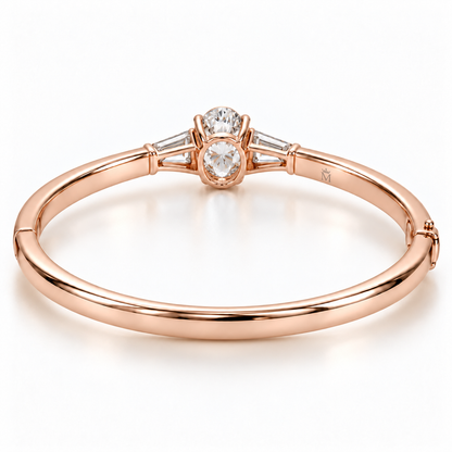 MISSISSI U09 Oval and Baguette bangle in 14K rose gold, rear open-gallery and inner-band engraving view; design visualization of a closed oval bangle with a vertical oval diamond and two tapered baguette side diamonds.