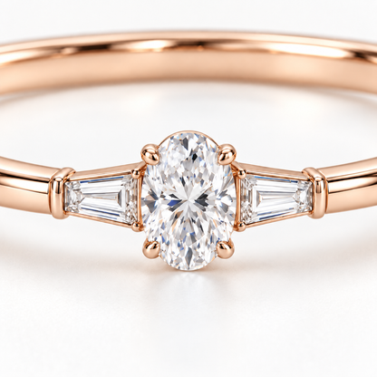 MISSISSI U09 Oval and Baguette bangle in 14K rose gold, oval and tapered baguette diamond macro; design visualization of a closed oval bangle with a vertical oval diamond and two tapered baguette side diamonds.