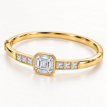 MISSISSI U10 Asscher-cut lab-grown diamond closed oval bangle in 14K yellow gold, three-quarter view, with three princess-cut diamonds on each shoulder.