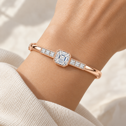 MISSISSI U10 Asscher-cut lab-grown diamond closed oval bangle in 14K soft rose gold, adult wrist worn view, with three princess-cut diamonds on each shoulder.