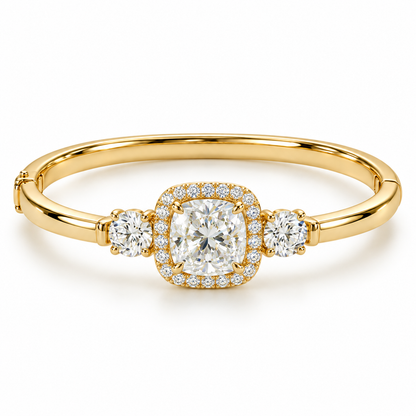 MISSISSI U11 cushion-cut lab-grown diamond halo closed oval bangle in 14K yellow gold, white-background hero, with one round diamond on each shoulder.