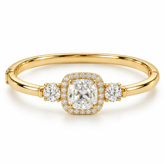 MISSISSI U11 cushion-cut lab-grown diamond halo closed oval bangle in 14K yellow gold, white-background hero, with one round diamond on each shoulder.