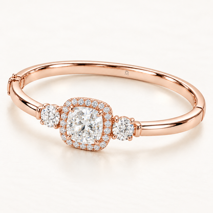 MISSISSI U11 cushion-cut lab-grown diamond halo closed oval bangle in 14K soft rose gold, three-quarter view, with one round diamond on each shoulder.