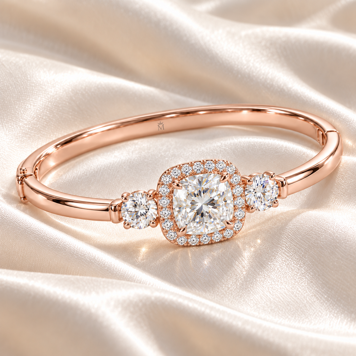 MISSISSI U11 cushion-cut lab-grown diamond halo closed oval bangle in 14K soft rose gold, ivory silk still life, with one round diamond on each shoulder.