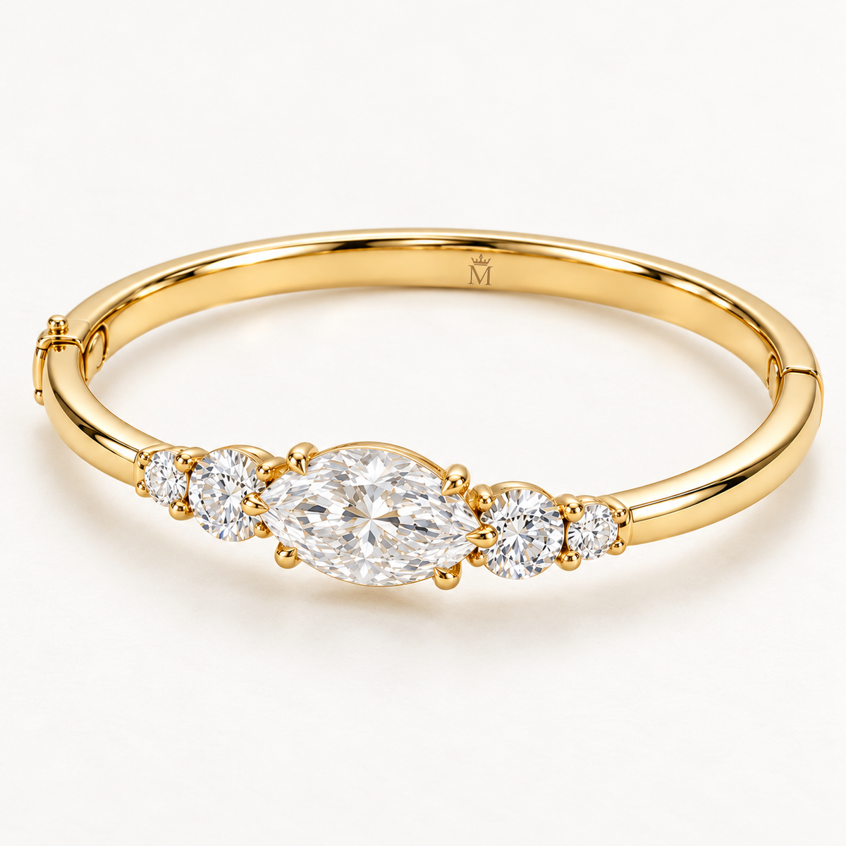MISSISSI U12 east-west marquise-cut lab-grown diamond closed oval bangle in 14K yellow gold, three-quarter view, with two graduated round diamonds on each shoulder.