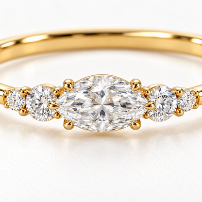 MISSISSI U12 east-west marquise-cut lab-grown diamond closed oval bangle in 14K yellow gold, setting macro, with two graduated round diamonds on each shoulder.