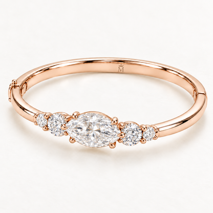 MISSISSI U12 east-west marquise-cut lab-grown diamond closed oval bangle in 14K soft rose gold, three-quarter view, with two graduated round diamonds on each shoulder.