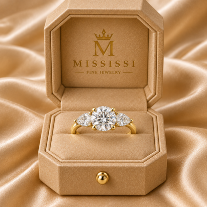 U17 round and pear three-stone lab-grown diamond ring in 14K yellow gold inside the official champagne MISSISSI box, design visualization