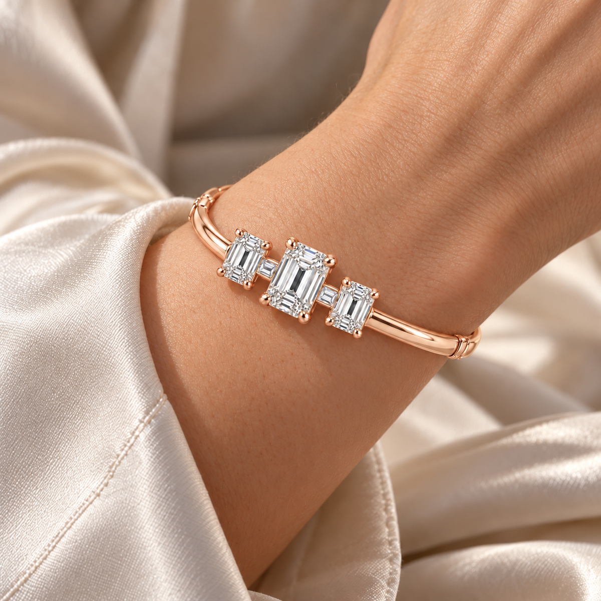 MISSISSI Emerald Ladder diamond oval bangle in pale champagne rose gold, worn view