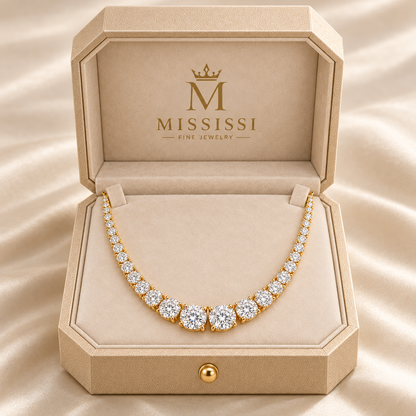 MISSISSI graduated round lab-grown diamond Riviere necklace in yellow gold, presented in champagne octagonal packaging with crown M branding; design visualization.