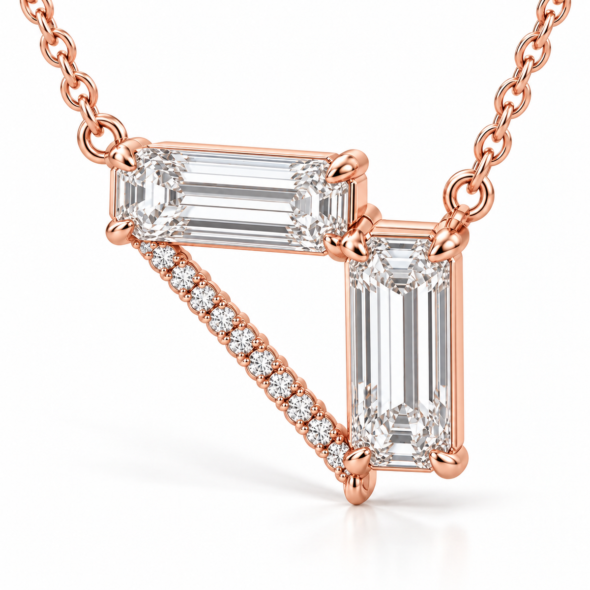 MISSISSI Z08 pale rose gold-tone necklace, three quarter view showing a horizontal emerald-cut diamond, a vertical emerald-cut drop and a diagonal line of round diamonds forming an open triangle; design visualization