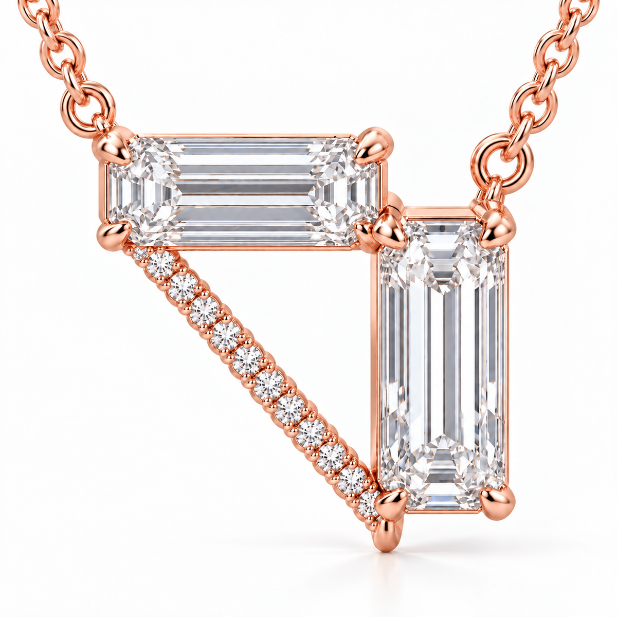 MISSISSI Z08 pale rose gold-tone necklace, macro detail view showing a horizontal emerald-cut diamond, a vertical emerald-cut drop and a diagonal line of round diamonds forming an open triangle; design visualization
